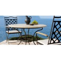 Table de repas ronde pour l'extérieur Capri de Manutti - Cadre brun frotté, plateau pierre santigo sable